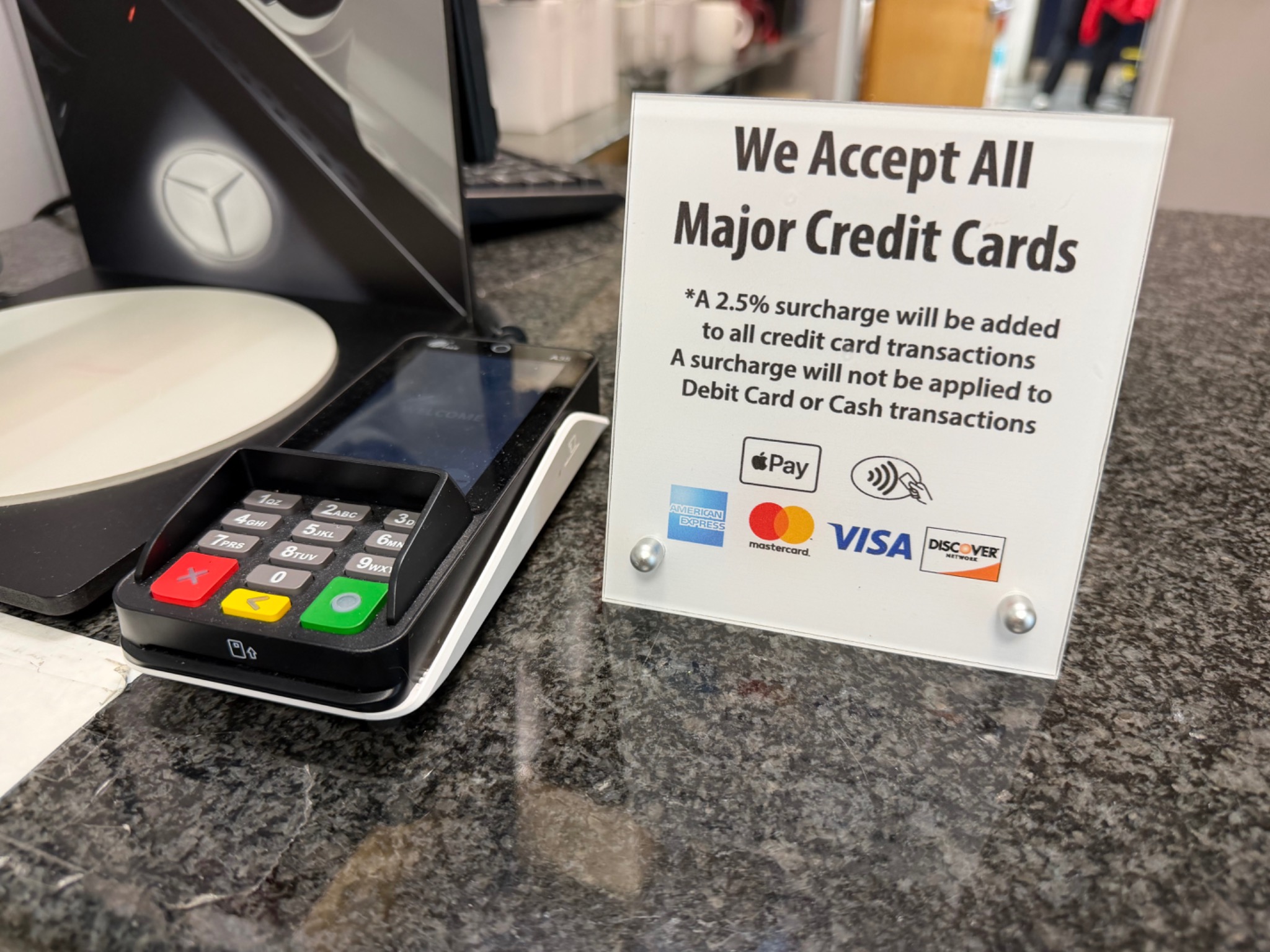 Real dealership surcharge signage example